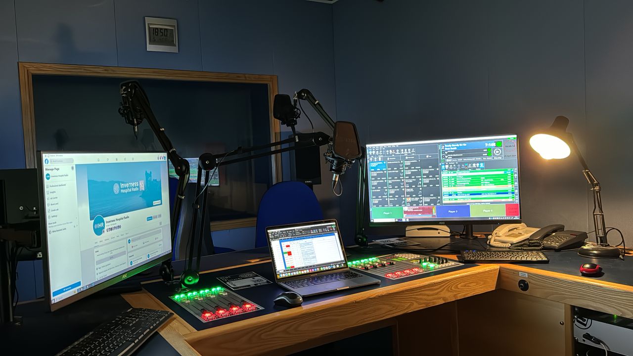 An image of the Highland Hospital Radio studio, with computer screens and presenter control desk